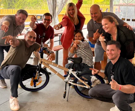 Team assembling a charity bicycle